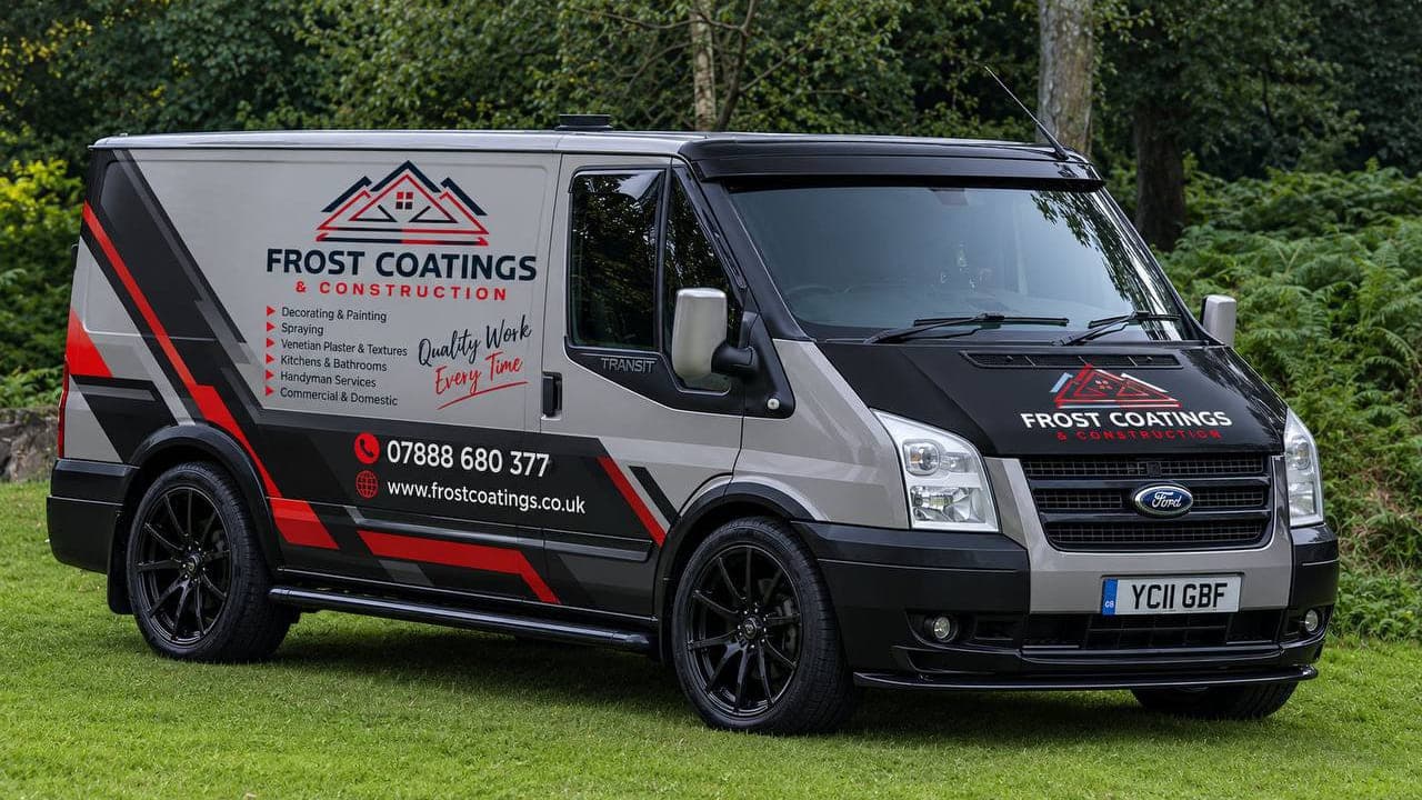 The company van, sign written with the Frost Coatings and Construction mark, the phone number and the website address